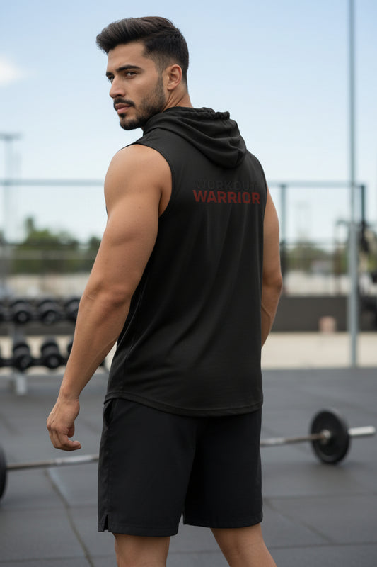 Man wearing a black sleeveless hoodie with 'WARRIOR' branding outdoors.