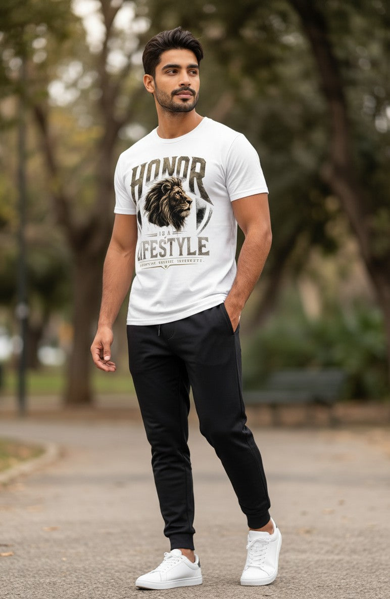 Man wearing a white t-shirt with a graphic design outdoors
