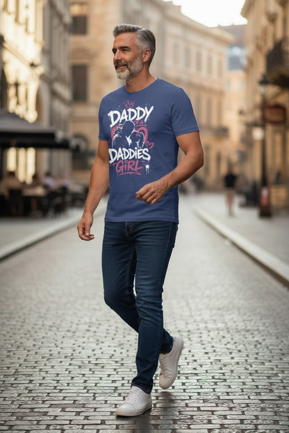 Man walking on a street wearing a blue t-shirt with text and graphics.