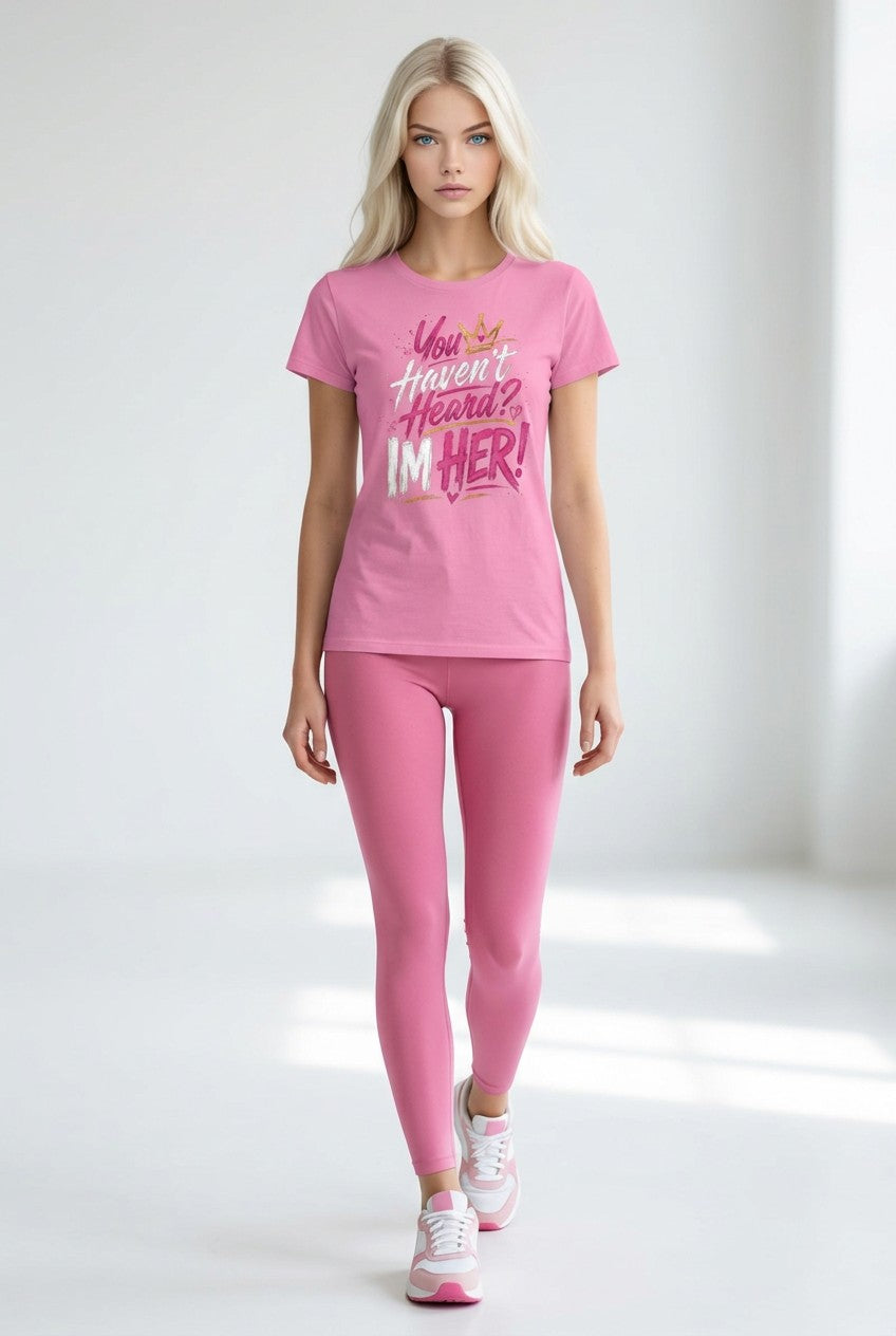 Woman wearing a pink outfit with a graphic t-shirt and leggings on a white background
