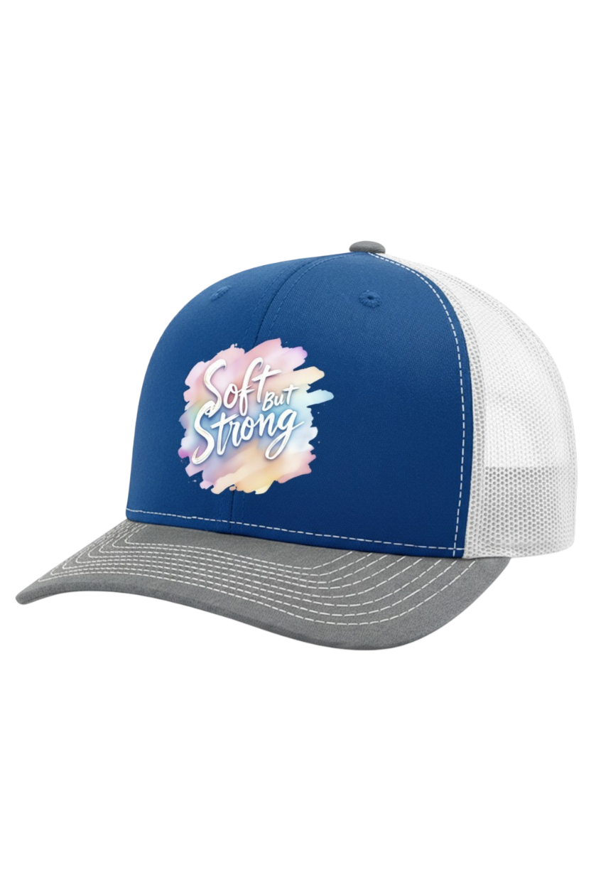 Blue and white cap with 'Soft but Strong' text and floral design on a white background