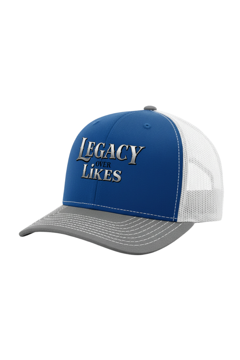 Blue and white cap with 'Legacy Over Likes' text on a white background