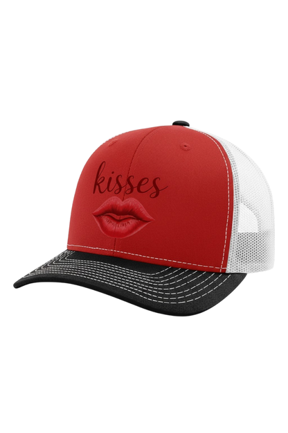 Red and black cap with 'kisses' and a lip design on a white background