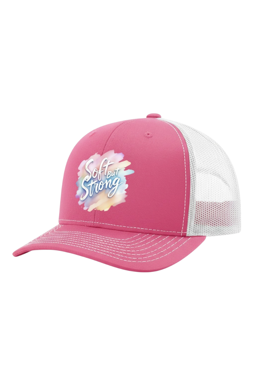Pink cap with 'Girl be Strong' text on a white background