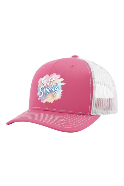 Pink cap with 'Girl be Strong' text on a white background