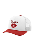 White cap with red brim and red lips graphic, featuring the word 'kisses'.
