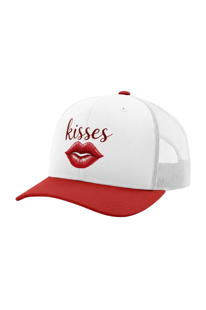 White cap with red brim and red lips graphic, featuring the word 'kisses'.