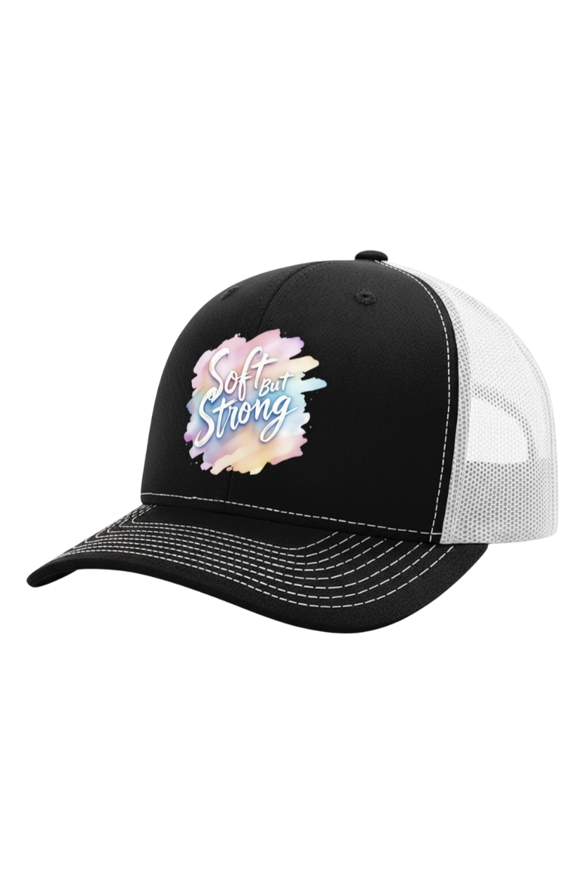 Black and white cap with 'Softly Strong' design on a white background
