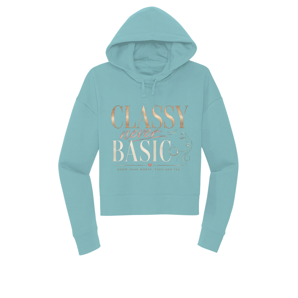 A light blue cropped hoodie with a rose gold graphic on the front reading 'CLASSY never BASIC' and 'HOW YOUR MOTHER WOULD FEEL' below it, shown on a plain white background.