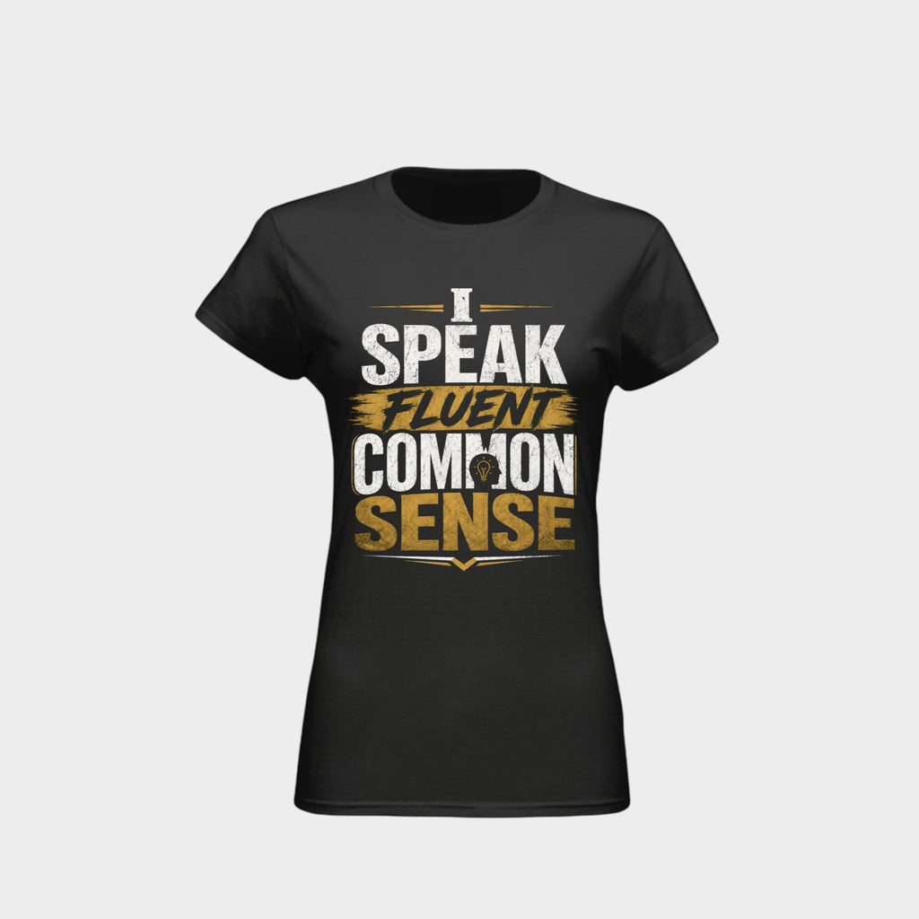A black short-sleeve crewneck t-shirt with a graphic print on the front reading 'I SPEAK FLUENT COMMON SENSE' in white and gold lettering, displayed on a light gray background.