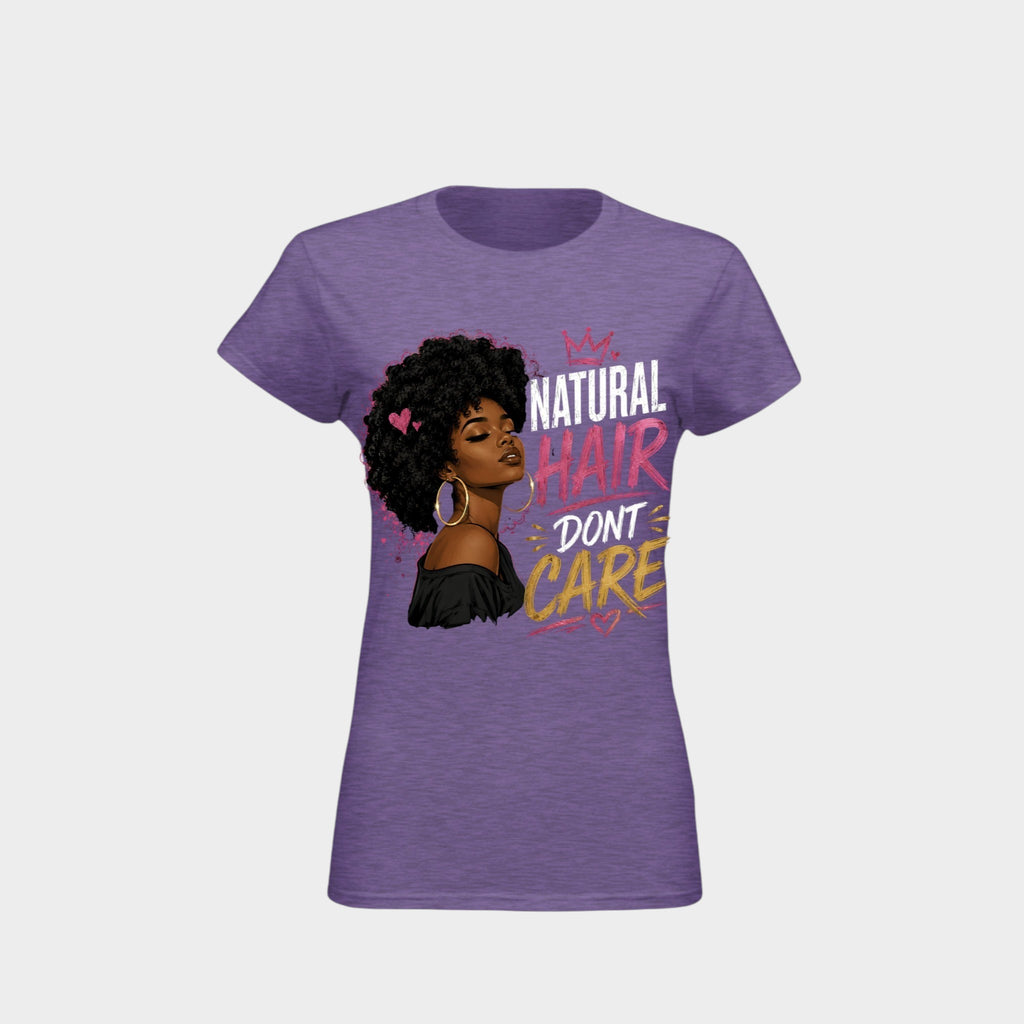A women's heather purple short-sleeve t-shirt with a graphic print of a Black woman with natural hair and the text 'NATURAL HAIR DON'T CARE' in white, pink, and yellow lettering, shown against a light gray background.
