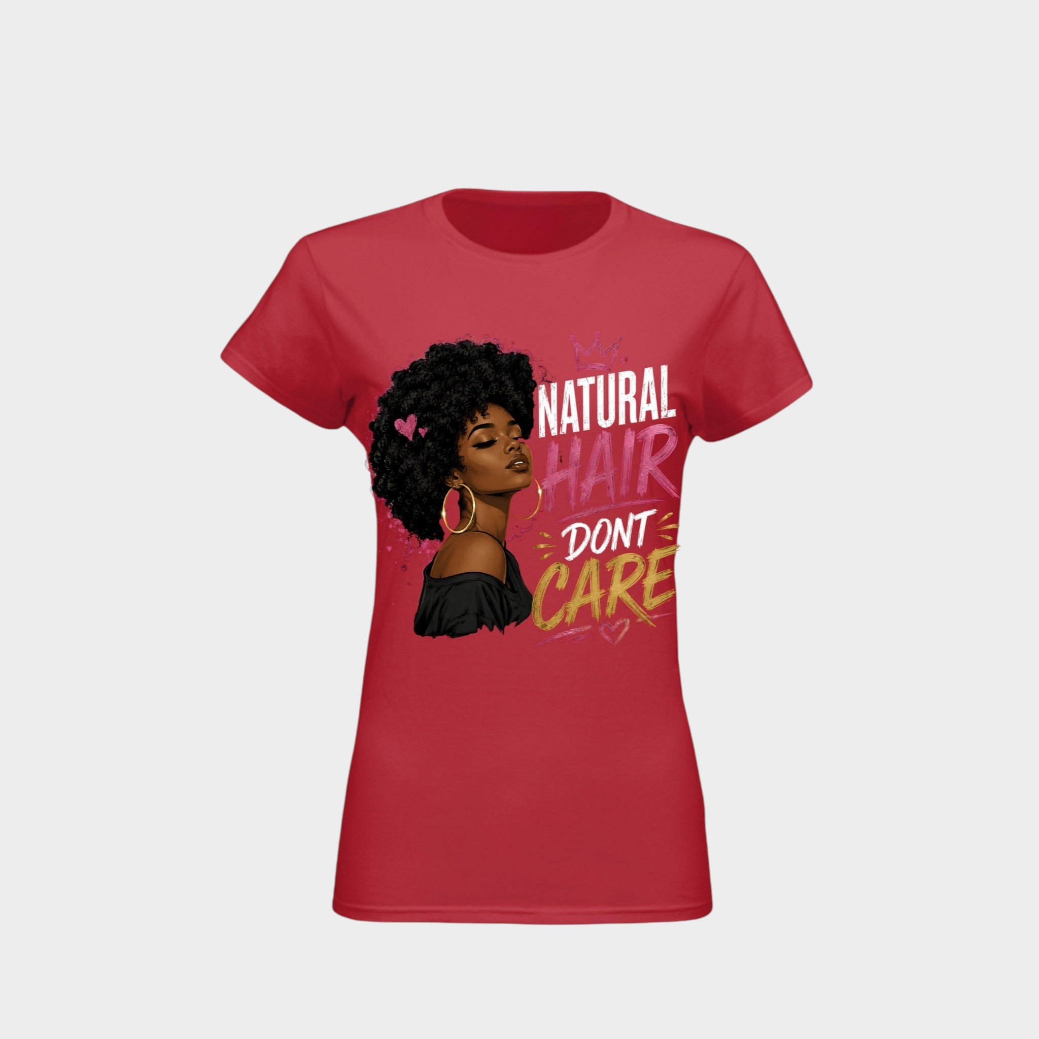 A red short-sleeve crewneck t-shirt featuring a graphic print of a Black woman with an afro hairstyle, pink heart-shaped earrings, and the text 'NATURAL HAIR DON'T CARE' in white, pink, and yellow lettering.