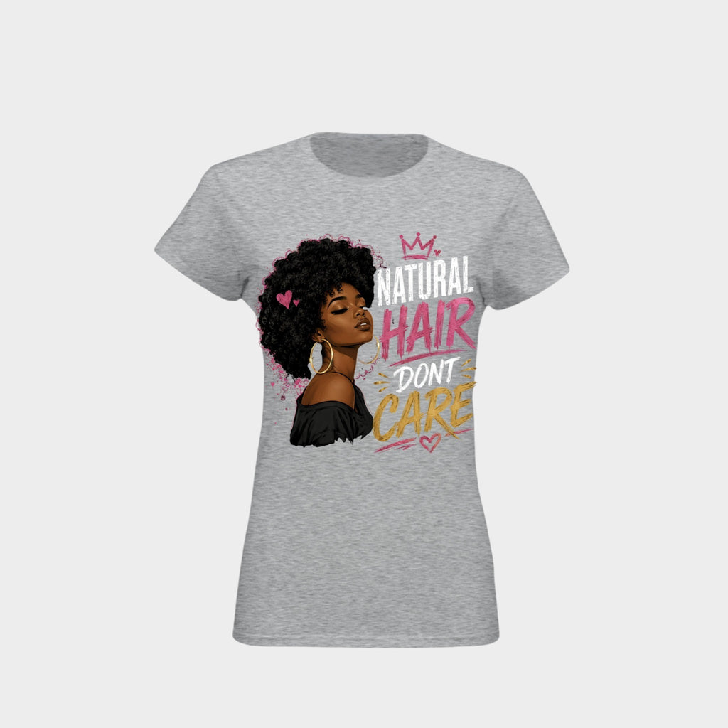 A women's heather gray short-sleeve t-shirt with a graphic print of a Black woman with an afro and the text 'NATURAL HAIR DON'T CARE' in white, pink, and yellow lettering.