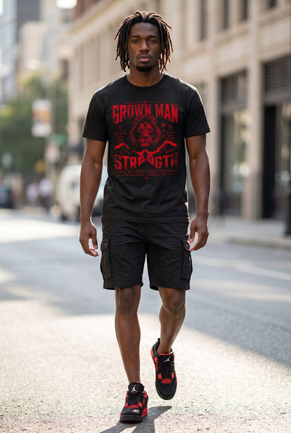 Man walking on a street wearing a black t-shirt with red text and black cargo shorts.