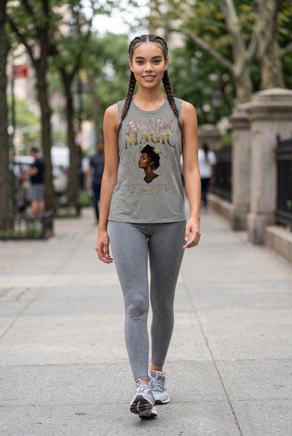 Woman walking on a sidewalk wearing a tank top with a graphic design and text.