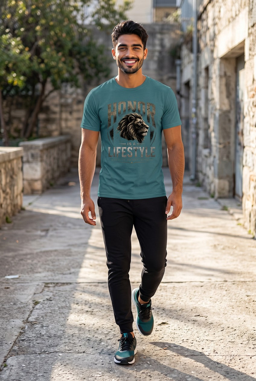 Man walking down a stone alleyway wearing a teal t-shirt with a lion graphic and text.