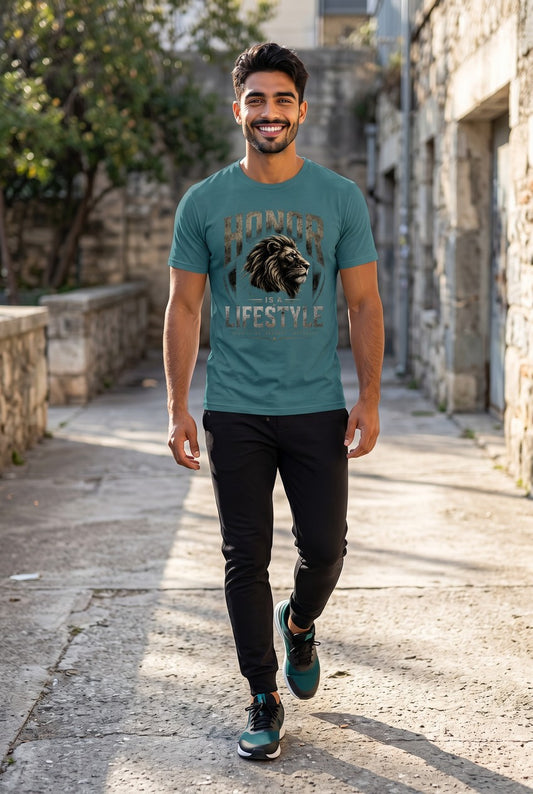 Man walking down a stone alleyway wearing a teal t-shirt with a lion graphic and text.