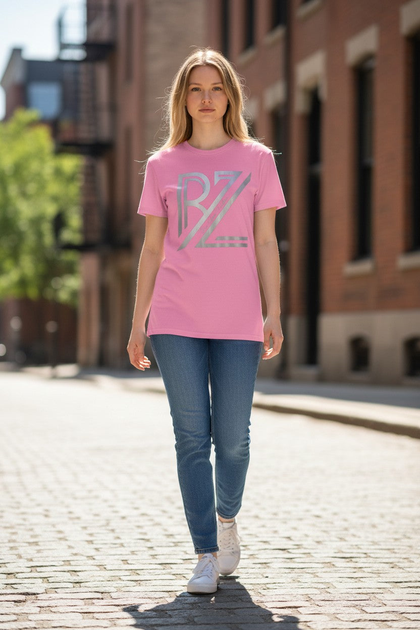 Woman wearing a pink t-shirt with 'RZ' logo walking on a street.
