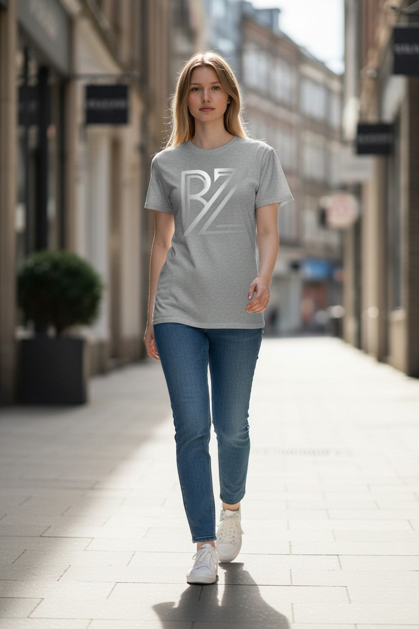 Woman wearing a gray t-shirt with a logo on a city street