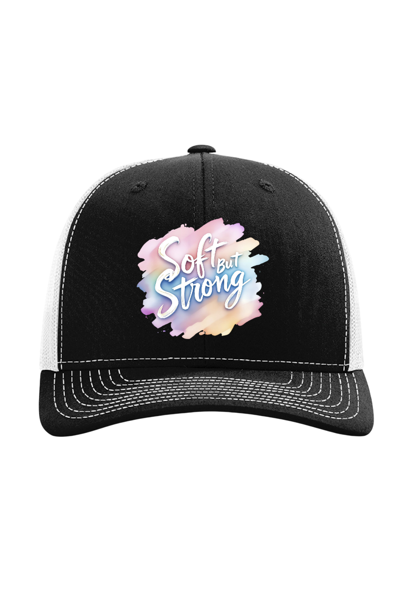 Black and white cap with 'Soft and Strong' text on a watercolor background
