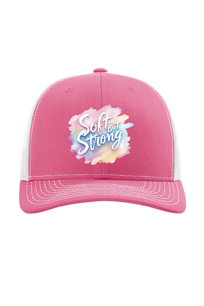 Pink cap with 'Soft and Strong' text on a white background