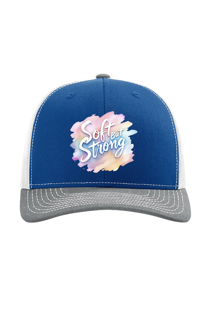 Blue and gray cap with 'Soft but Strong' text on a white background