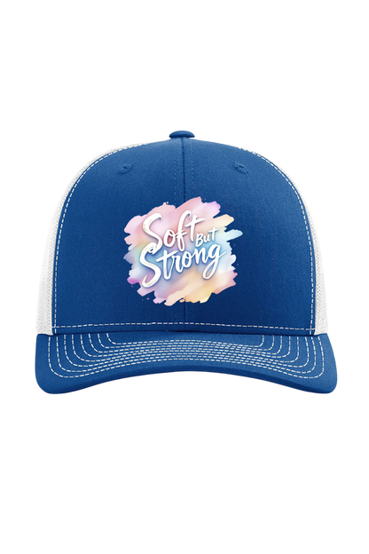 Blue and white cap with 'Soft but Strong' text on a white background