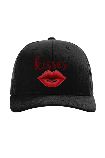 Black cap with red lips and 'kisses' text on a white background