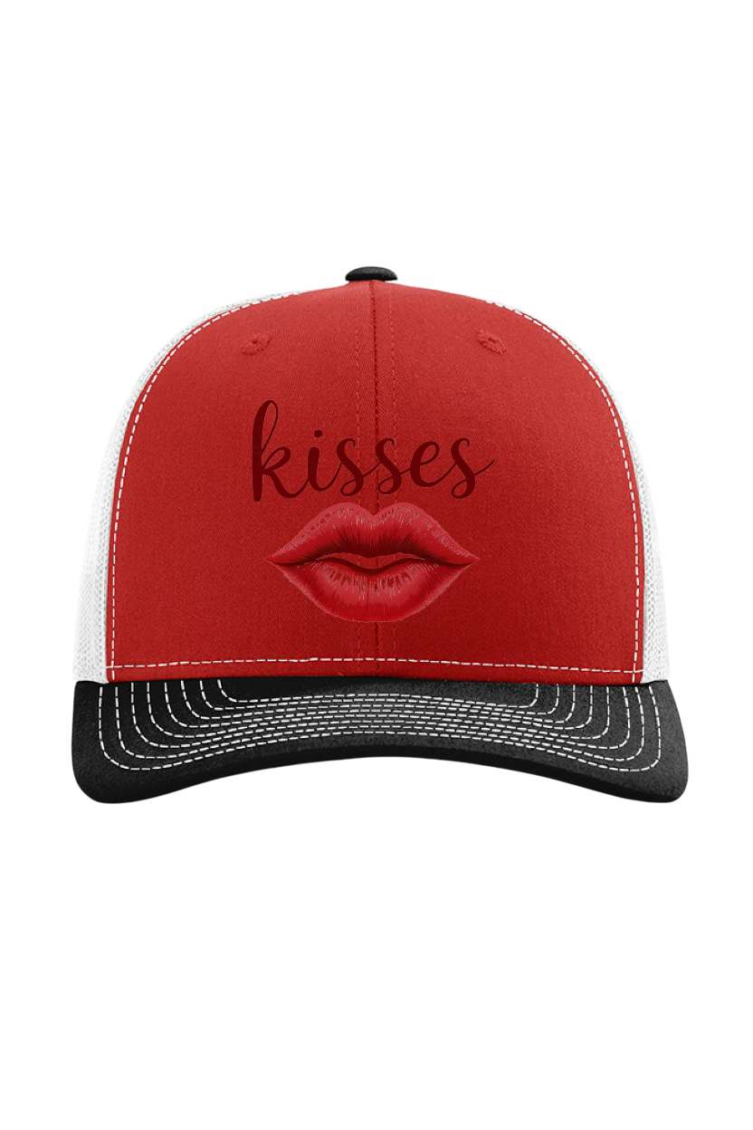 Red and black cap with lips and 'kisses' text on a white background