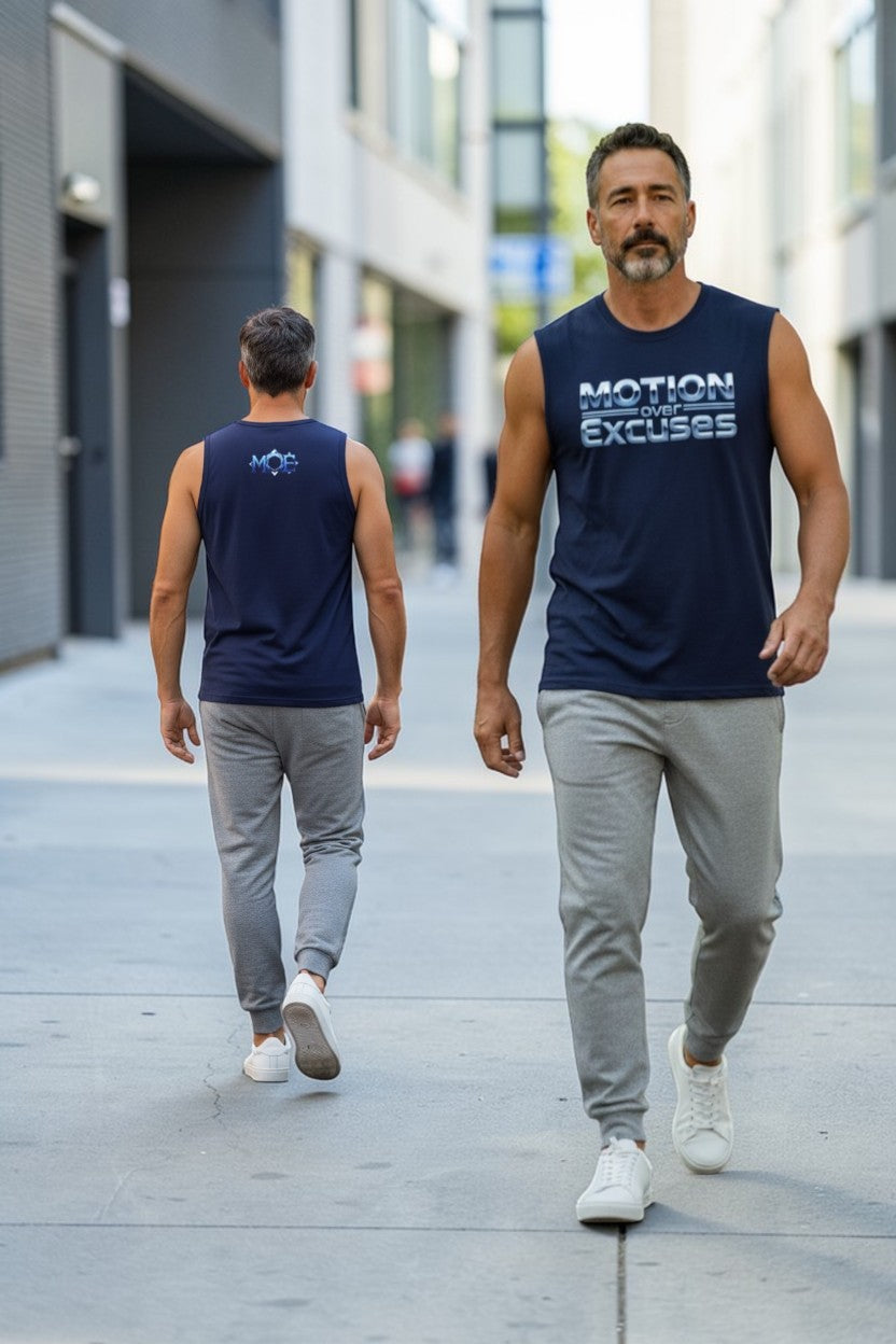 Two men walking on a city street wearing matching navy sleeveless shirts with text.