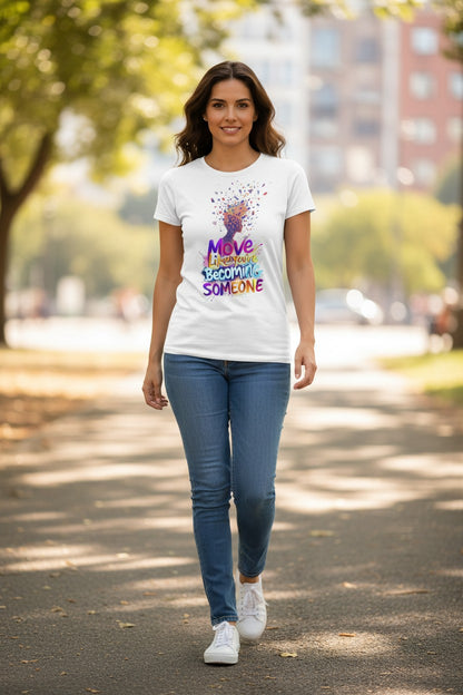 Woman walking outdoors wearing a white t-shirt with colorful text and graphics.