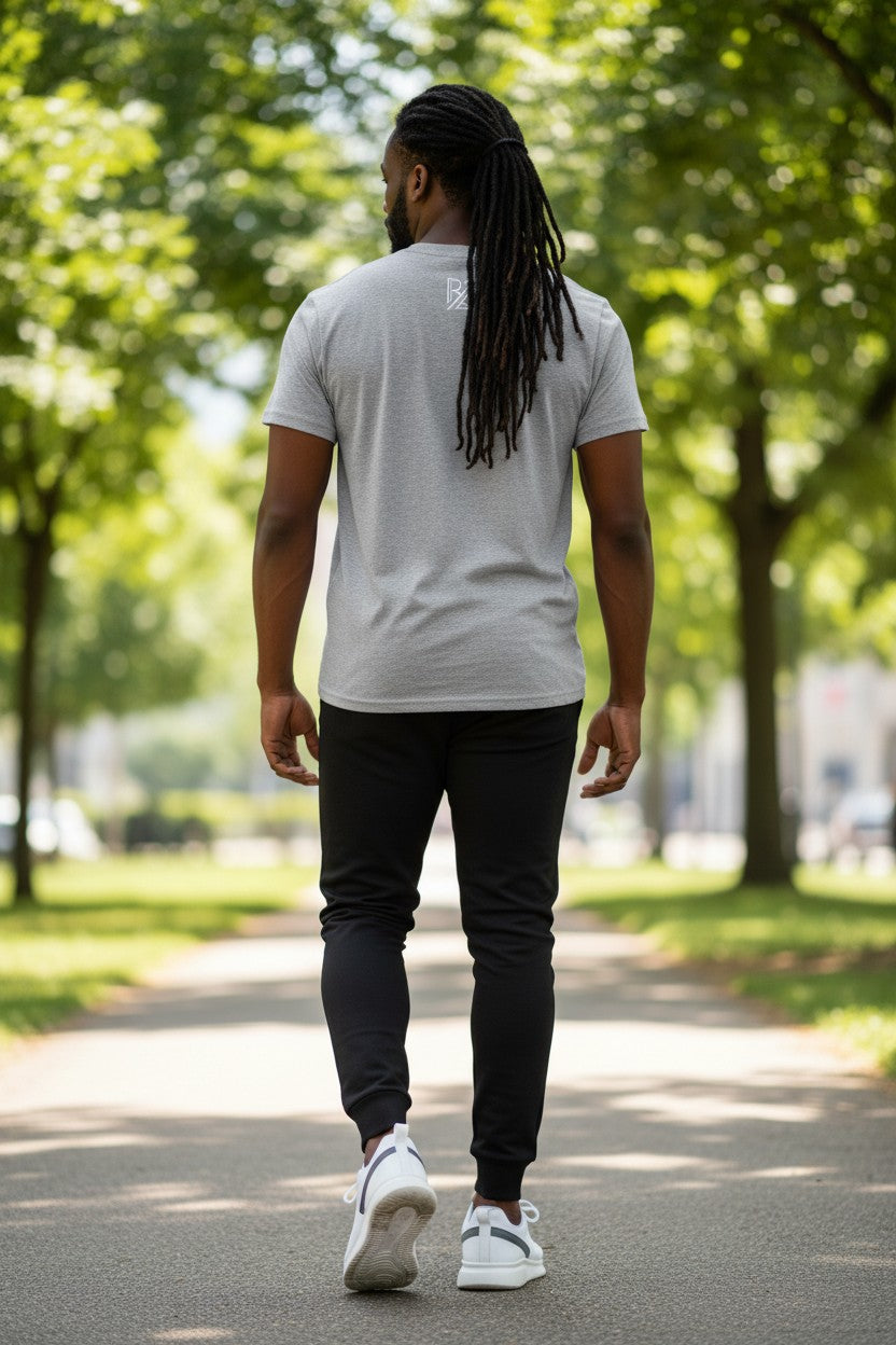 Man walking on a path with trees in the background