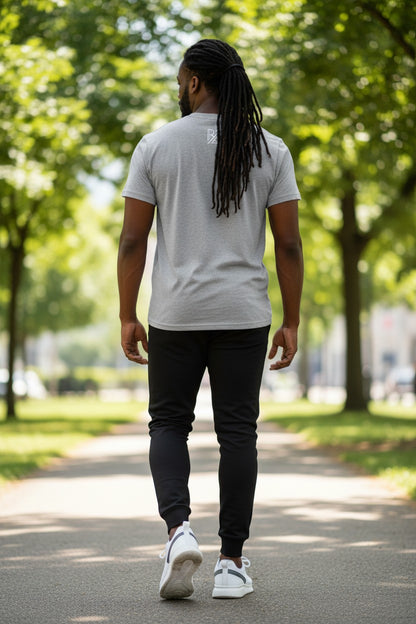 Man walking on a path with trees in the background