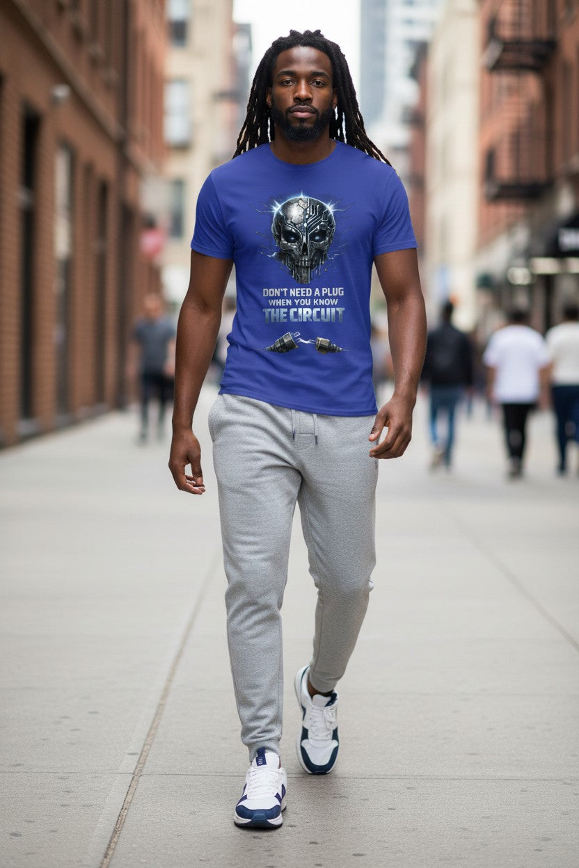 Man walking on a city street wearing a blue t-shirt with graphic design and text.