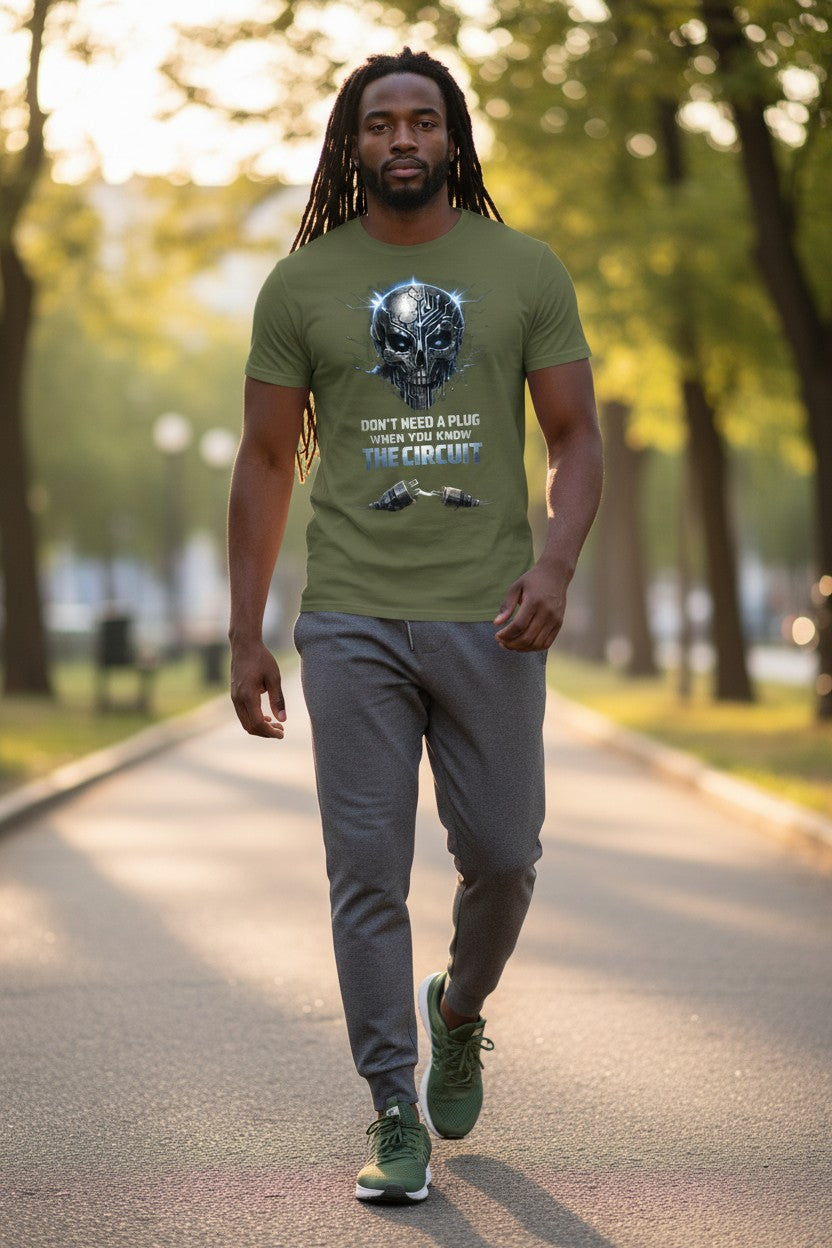 Man walking on a path wearing a green t-shirt with a graphic design.