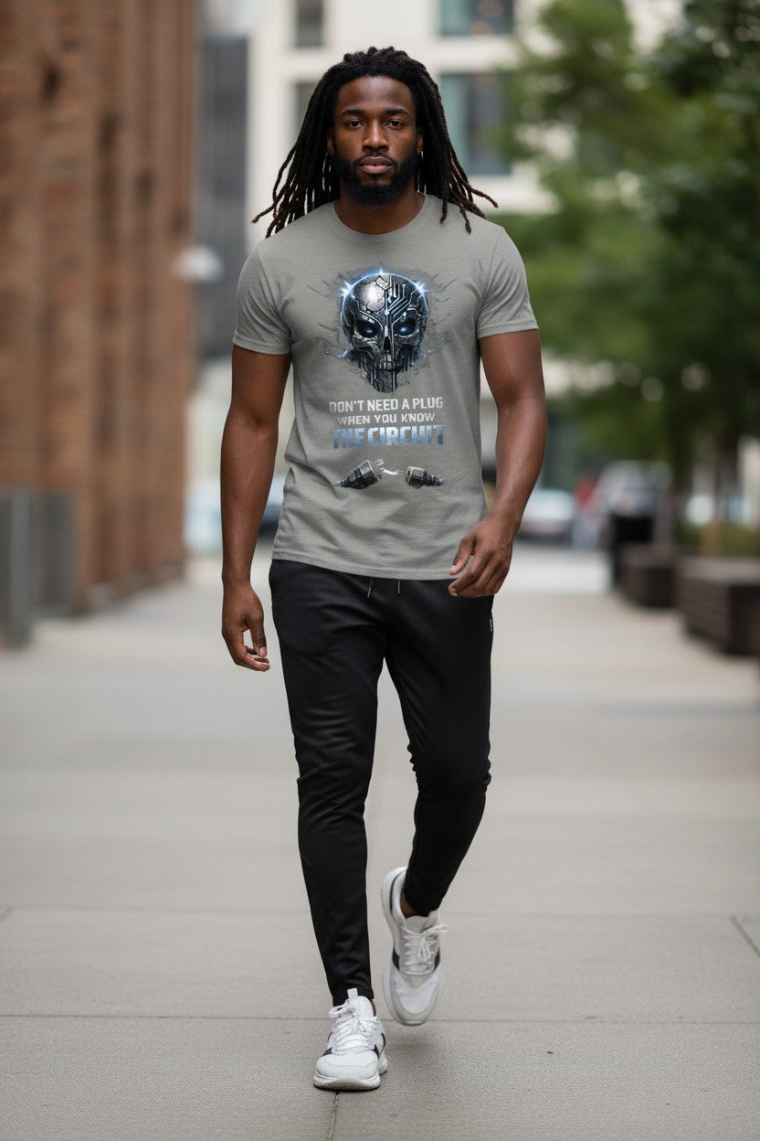 Man walking on a sidewalk wearing a gray t-shirt with a graphic design.