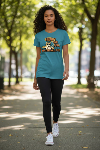 Woman wearing a blue t-shirt with a graphic design outdoors