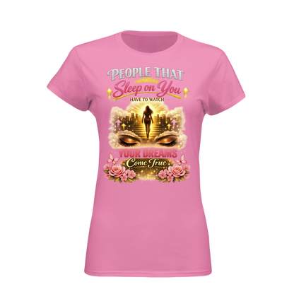 Pink t-shirt with graphic design and text on a white background