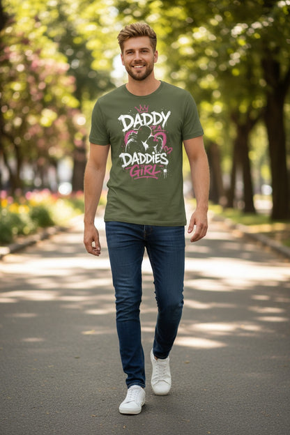 Man wearing a green t-shirt with 'Daddy' and 'Daddies Girl' text, walking on a tree-lined path.