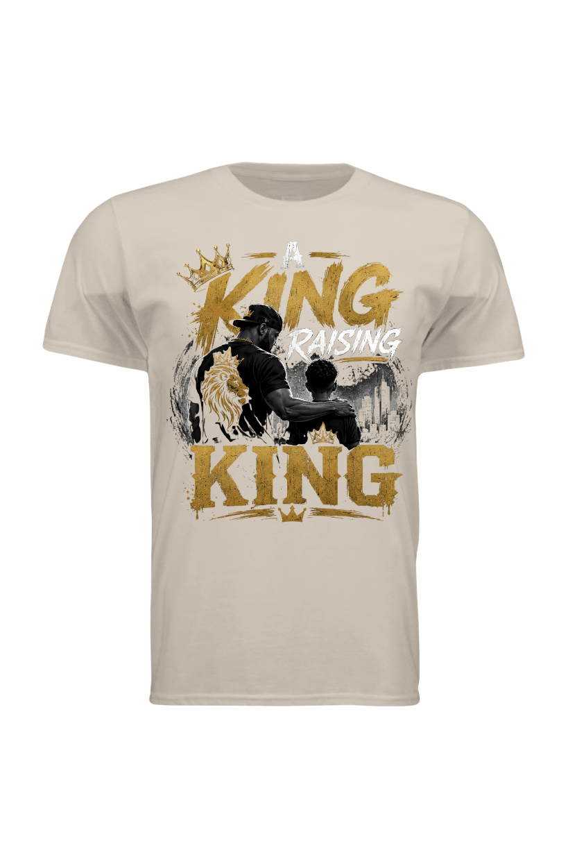 Beige t-shirt with graphic design of a father and son with text 'A King Raising King' on a white background
