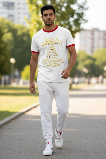 Man walking outdoors wearing a white t-shirt with red trim and white pants.