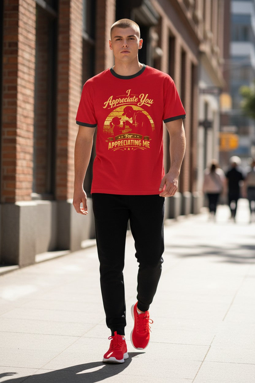 Man wearing a red t-shirt with text and graphics, walking on a city street.