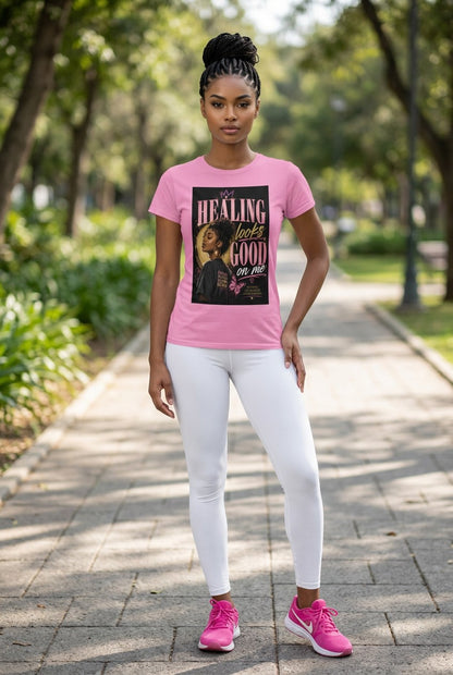 Woman wearing a pink t-shirt with a graphic design in a park
