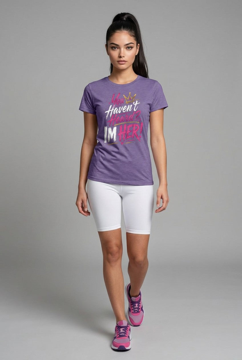 Woman wearing a purple t-shirt with text and white shorts on a gray background