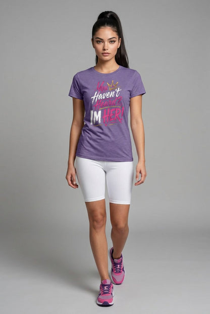 Woman wearing a purple t-shirt with text and white shorts on a gray background