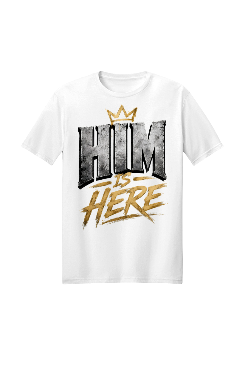 White t-shirt with 'HIM IS HERE' text and gold crown on a white background