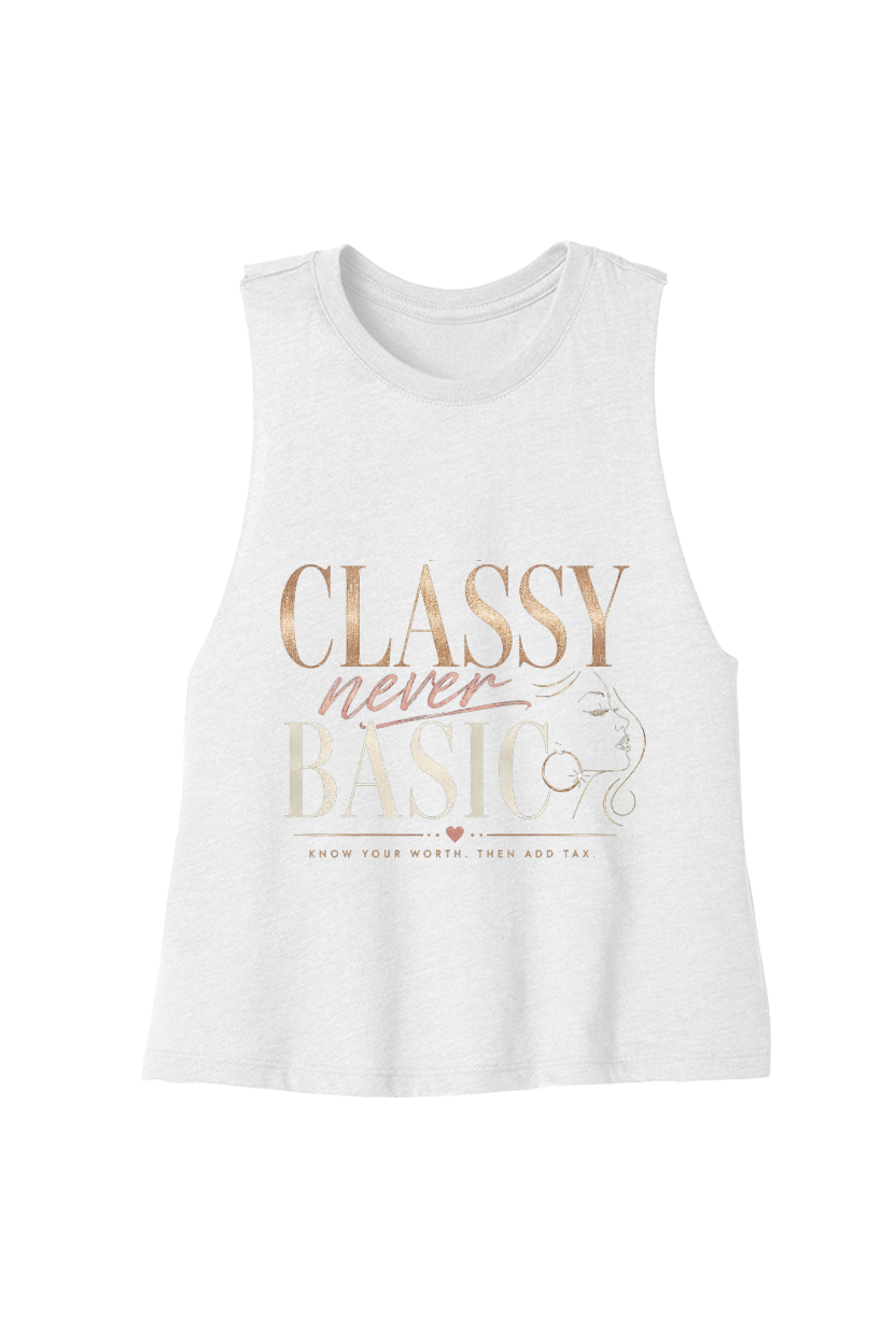 A white sleeveless tank top with a graphic print on the front reading 'CLASSY never BASIC' in rose gold and beige lettering, displayed against a solid white background.