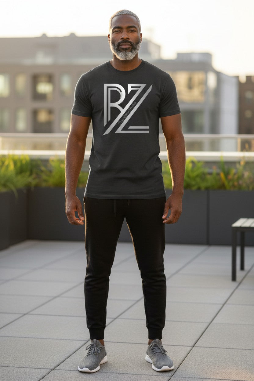 Man wearing a black t-shirt with a logo on a rooftop