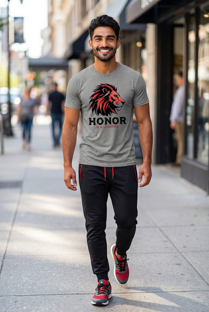 Man walking on a sidewalk wearing a gray t-shirt with a lion graphic and 'Honor' text.