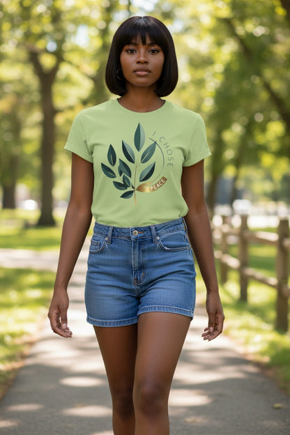 Person wearing a green t-shirt with a leaf design outdoors